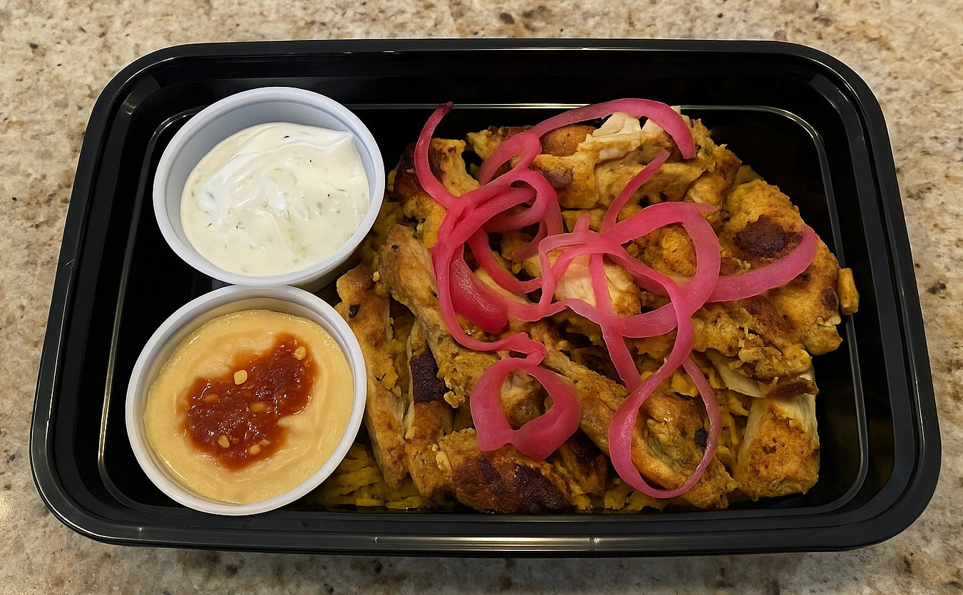 Chicken Thigh Shawarma with Turmeric Rice, Hummus, Pickled Onions, and Tzatziki Sauce